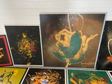 four framed pictures of different types of artwork on the wall