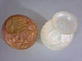 two vases that are sitting next to each other on a table