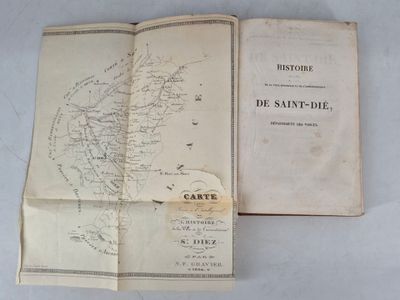 an open book with a map on it sitting on a table