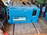 a blue tool box sitting on top of a wooden table