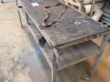 a workbench with tools on top of it in a warehouse