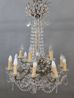 IMPORTANT LUSTRE à quinze lumières sur deux hauteurs, décor de pampill