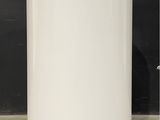 a white water heater sitting on top of a counter top