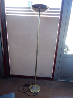 an image of a floor lamp in front of a door