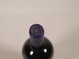 a bottle of wine that is sitting on a table