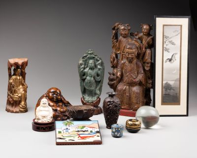 a lot of asian figurines on a table