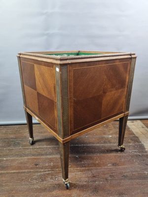 an image of a small wooden table with a green top