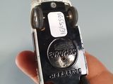 a person holding an old cell phone in their hand