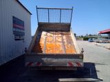 a dump truck that is sitting in the parking lot