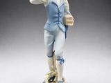 an image of a figurine of a man holding a basket