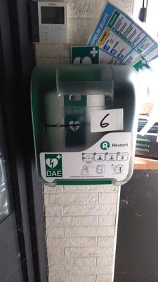 a parking meter on the side of a building