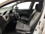 the interior of a small car with a steering wheel and a dashboard