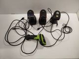 four different types of corded phones on a white surface