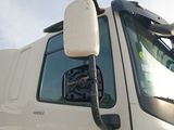 a white truck with a mirror on the side of it