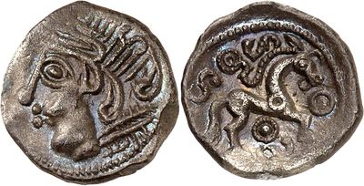 a silver coin with an image of a woman on it