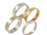 three different types of wedding rings on a white background
