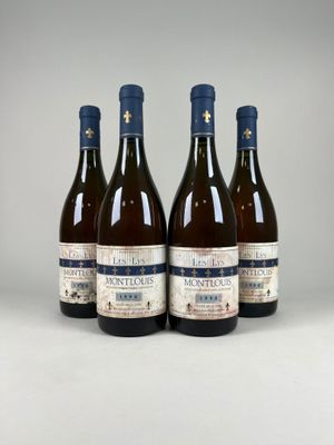 three bottles of wine sitting on top of a white table