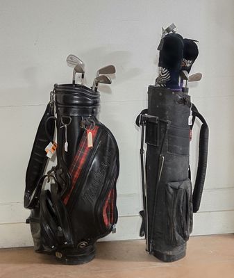 two golf clubs and a bag on the floor
