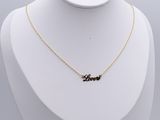 a gold plated necklace with the word love on it