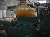 a picture of a machine that is working on a piece of wood