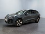 a grey audi suv parked in a large room
