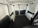 the interior of a white van with black trims and a black floor
