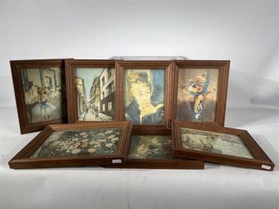 four framed pictures of a woman and a child in a room