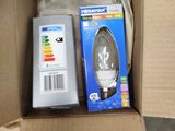 a box with a light bulb and a remote in it