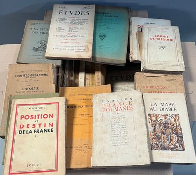 several books are stacked on top of each other on a table