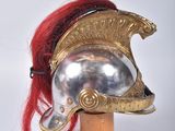 a helmet with a red hair on a wooden stand