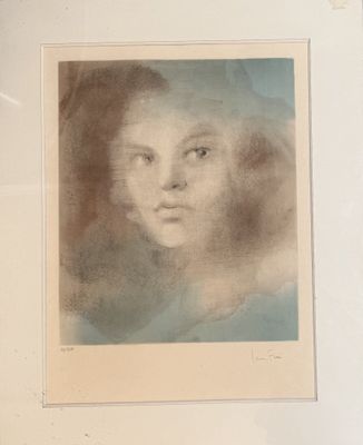 an old picture of a woman ' s face is shown in a white frame