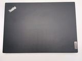 a black laptop with a sticker on it