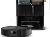 an image of a robotic vacuum cleaner with a box on top of it