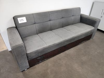 a couch that is sitting in the corner of a room