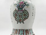 a white vase with a blue and red design on it