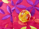 a close up of a piece of fabric with a flower design on it