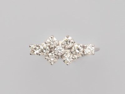 a close up of a diamond ring on a white background