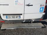 a white van with stickers on it parked in a parking lot