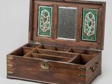 an old wooden box with a mirror in it on a white surface