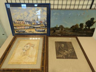 two framed pictures of a woman and a man on a table
