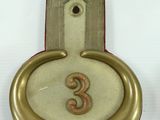 a clock that has a number on it on a table