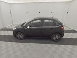 a picture of a black car parked in a garage
