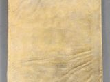 an old piece of paper on a gray surface