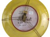 a yellow plate with a clock attached to it