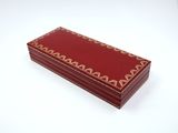 an image of a red box sitting on top of a white table
