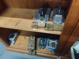 a wooden cabinet with a bunch of tools in it