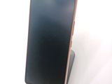 an image of a cell phone sitting on top of a stand
