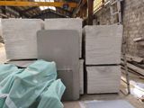 a large pile of white bricks in a warehouse