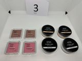 a white table topped with a box of makeup next to a sign