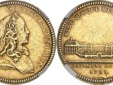 a gold coin with an image of a woman and a train on it
